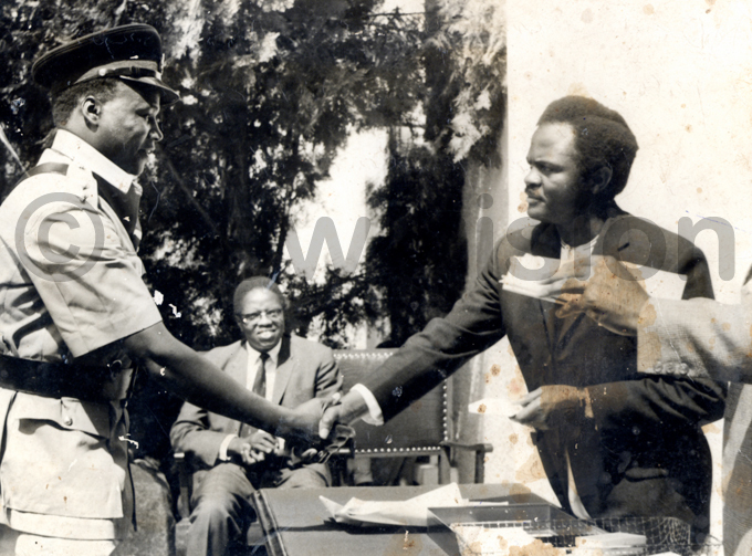 kangi during his time as atikkiro of uganda congratulates greets aniel emwogerere who had just joined engo olice from entral overnment
