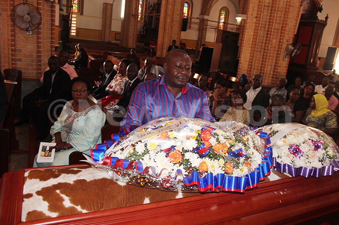  ity businessman and hairman of wagala roup odfrey irumira laying a wreath on the casket of the late enry ugembe alias big ways during a requiem mass on onday eb13