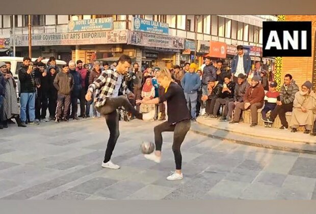 Freestyle footballers Aguska, Patrick display football juggling skills at Lal Chowk in Srinagar