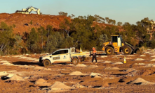  Whilst mining is underway at Anthill east pit (top left), adjacent benches have been drilled and loaded for firing.