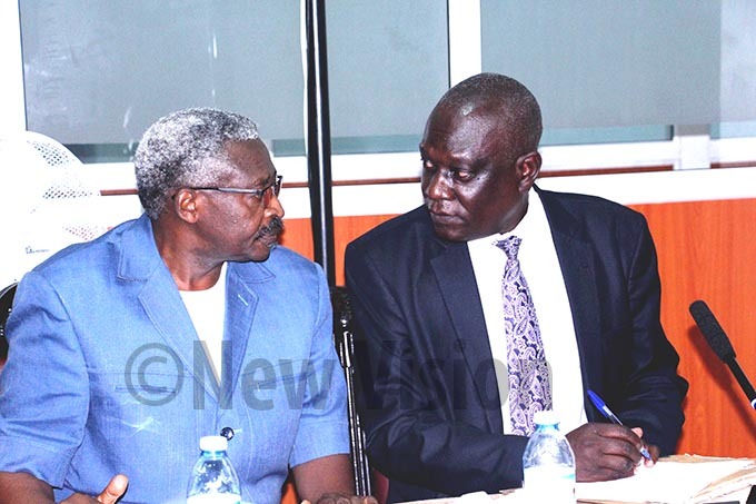  ohn aruhanga left with ommissioner obert pio appearing before the and inquiry commission at archives center ampala on onday 30th eptember 2019hoto by van abuye