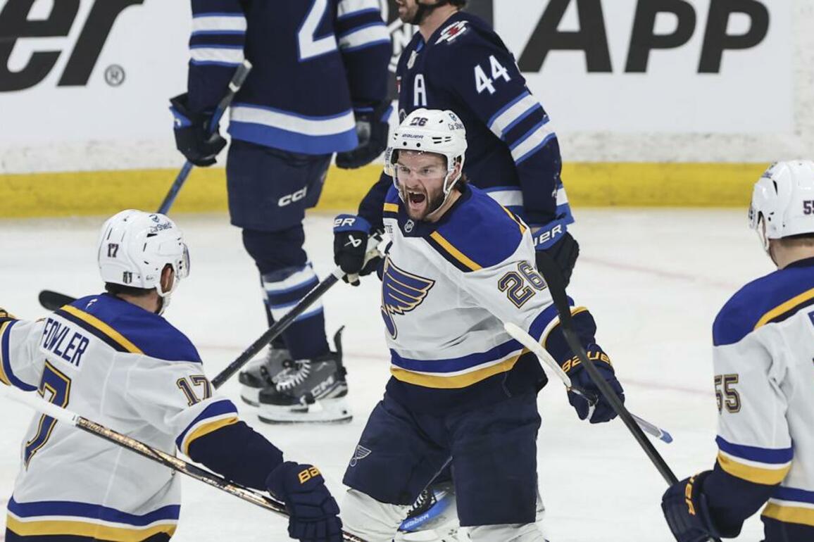 Walker having fun with the hard hitting in Blues-Jets series, and also scoring goals