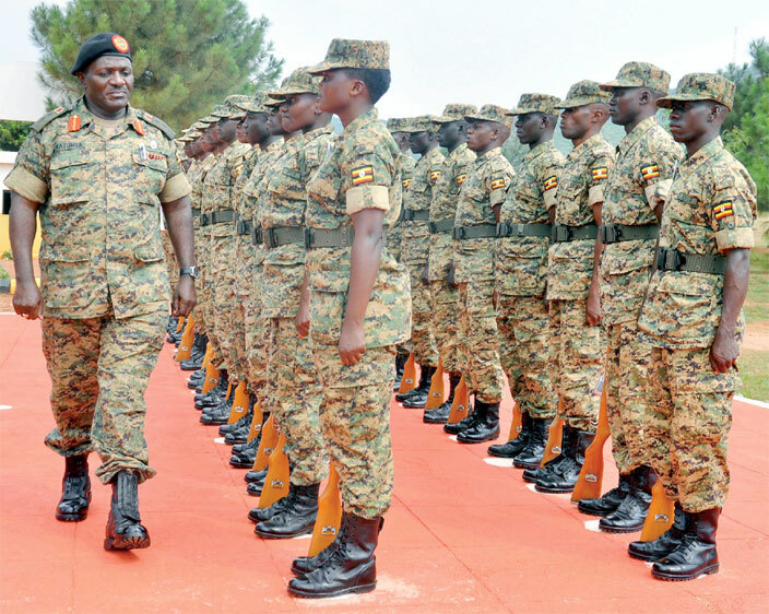 ormer chief of defence forces atumba amala inspects a guard of honour he  formerly  has grown from a ragtag guerrilla group into a professional army