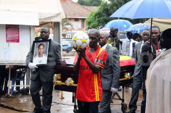 all bearers carry hairas casket for public viewing of the body outside ll aints athedral