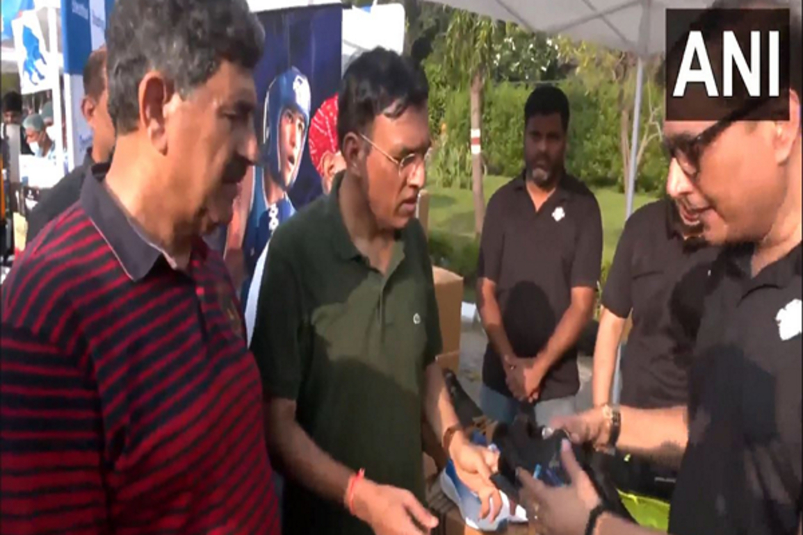 Delhi: Mansukh Mandaviya visits 'Garv se Swadeshi' stalls during 'Fit India' cycle rally in Dhyan Chand Stadium