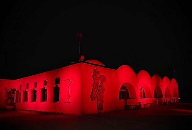 Israel: Kibbutzim lights up in red in memory of October 7 victims; Old City displays pictures of hostages