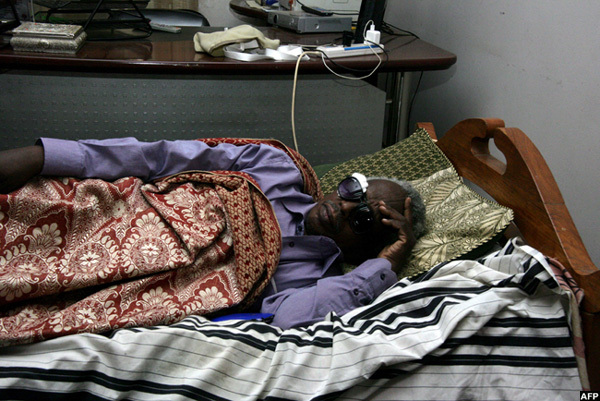  sman irghani chief editor of the layar daily lying on his bed on uly 24 2014 after he was severely beaten by armed men