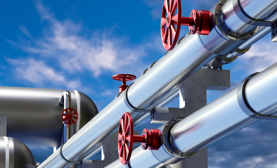Pipes for gas supply on concrete supports. Credit: Shutterstock/FOTOGRIN