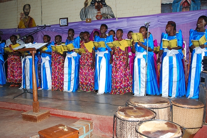 he t arys atholic arish choir performing carols during the hristmas service hoto by ndrew usinguzi