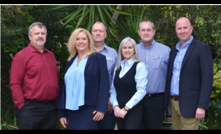  Hexagon's Mining Service & Support Director, Kobus Piennar (left) and EMEA Managing Director, Andrew Crose (right) flank Trysome's Tanya Bambrough, HOD Risk Technologies, Gunter Haacke, COO, Lesley Bennett, Chief of Staff, and Eddie Smith, CEO