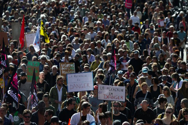 Thousands protest in France against Macron's austerity policies