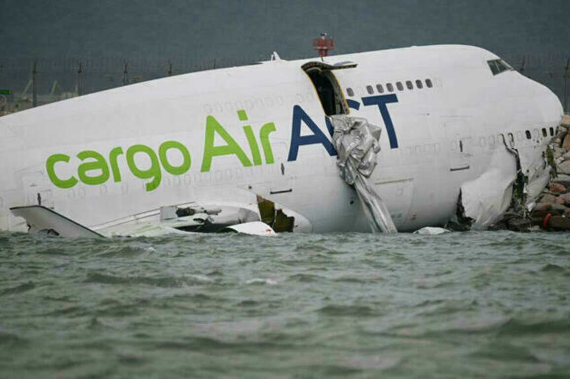 Cargo plane veers off Hong Kong runway and into sea, killing two