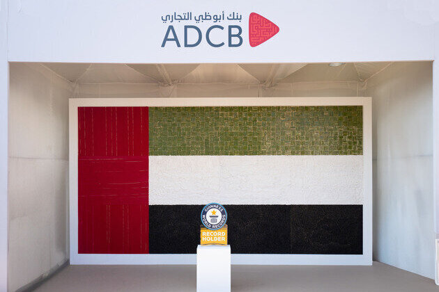 ADCB sets Guinness World Record with largest biodegradable UAE flag