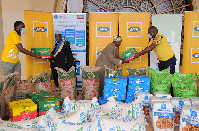  staff hand over food items to the upreme ufti heikh asule dirangwa secondleft at ibuli mosque	