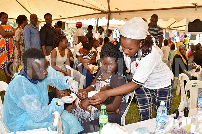   child being screened for sickle cell during the camp at irinya