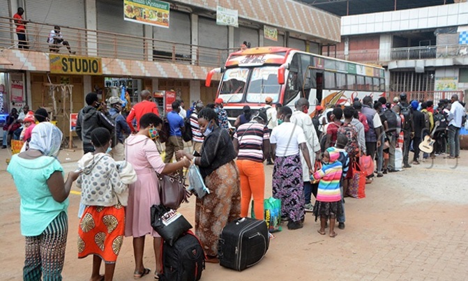 Passenger flock bus, taxi parks as public transport eases Passenger flock bus, taxi parks as public transport eases