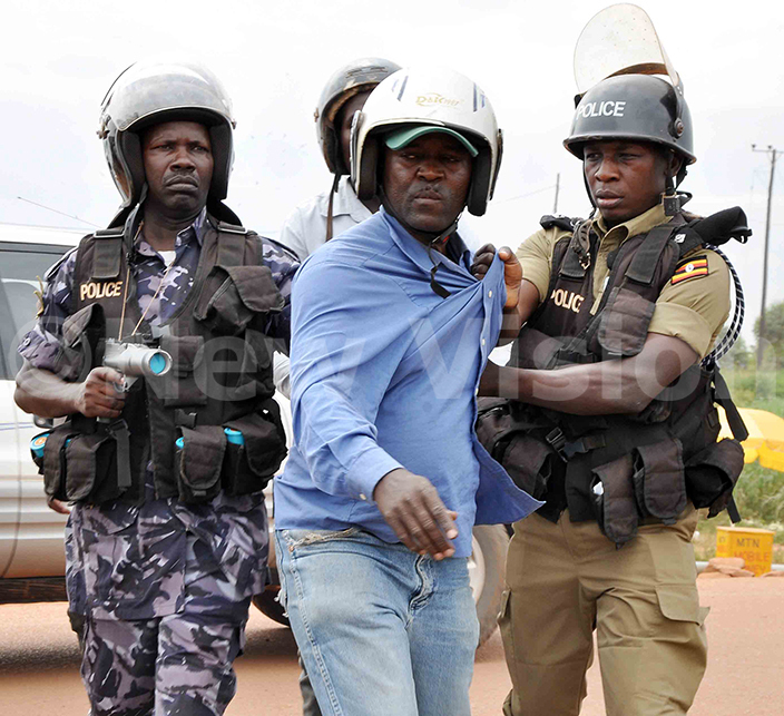  pc enard atwalo right and another policeman arresting afighting bodaboda man