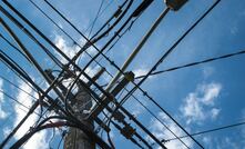 File photo: power cables intersect on a pole 