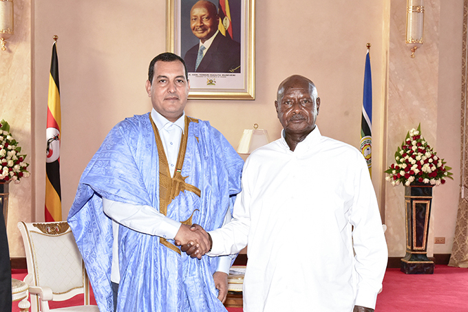 aharawi ambassador to ganda ohamed achir with resident useveni after presenting his credentials  hoto
