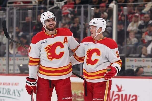 Flames hold on for win over struggling Devils
