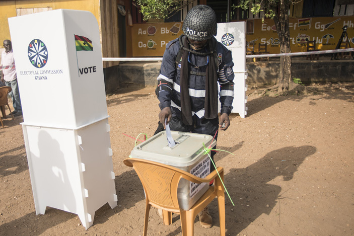   policeman casts his ballot for the presidential election at a polling station in ibi southern hana on ecember 7 2016     