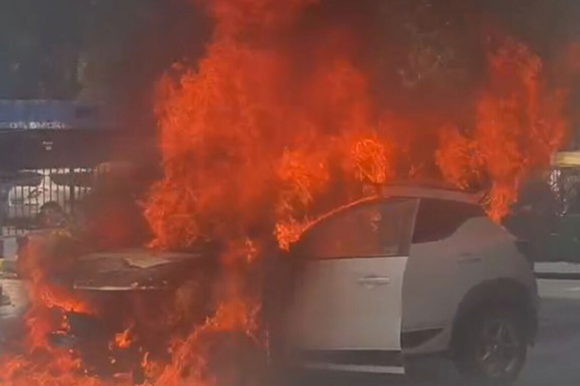 Car catches fire on Delhi's MB Road amid intense heat, two escape safely