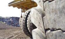 Giant mining tyres being used in a road sealant trial.