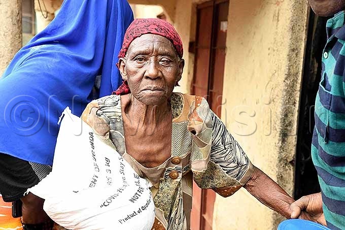  75year old atuma alubega after receiving food at her home in ubiri ing oad zone in atwe 1 in ampala pril 132020 hoto by ddie sejjoba