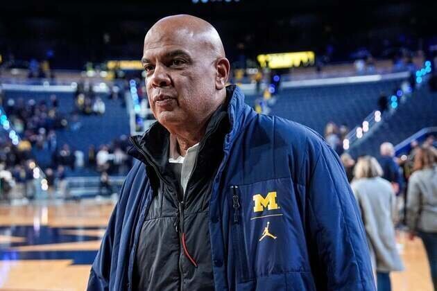 Report: Michigan AD warned coach not to travel with staffer