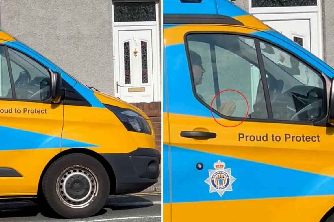 Shocking moment police camera van officer is caught with no hands on the wheel while driving