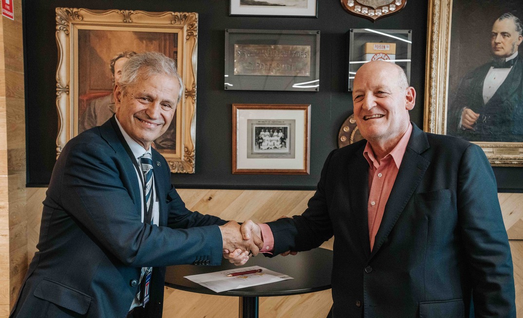 SmartSat CRC CEO, Professor Andy Koronios, and Elders CEO, Mark Allison, sign an MOU to drive space tech in Australian agriculture. Photo supplied.