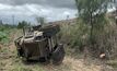  A skid steer machine fitted with a mulching attachment overturned while clearing vegetation on an embankment. 