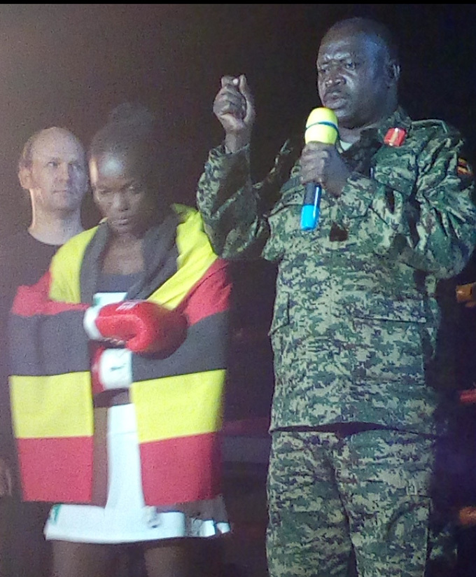  polot making ganda proud after winning a fight on the left is her coach ozman