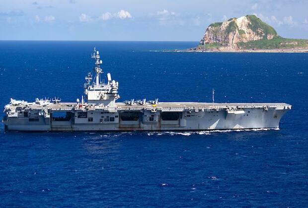 U.S. Navy carrier group sailing through disputed S. China Sea