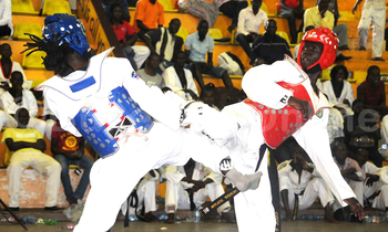Freddy Kangendo (ku kkono) nga yeeriga ne Royson Okwera owa Uganda mu mpaka za Tae Kwondo eza Korean Ambassadord Cup e Lugogo nga May 28 2017. Kangendo yawangudde ku bubonero 19-05.(ekif: Silvano Kibuuka) Freddy Kangendo (ku kkono) nga yeeriga ne Royson Okwera owa Uganda mu mpaka za Tae Kwondo eza Korean Ambassadord Cup e Lugogo nga May 28 2017. Kangendo yawangudde ku bubonero 19-05.(ekif: Silvano Kibuuka)