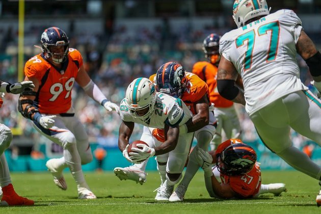 Dolphins pour it on with 70-20 rout over Broncos
