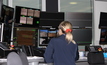 Female worker monitoring autonomous operations.