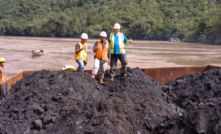 Three Cokal geologists Agung Frianto,Yoga Suryanegara and Pat Hanna on the first barge of Cokal’s PCI Coal.