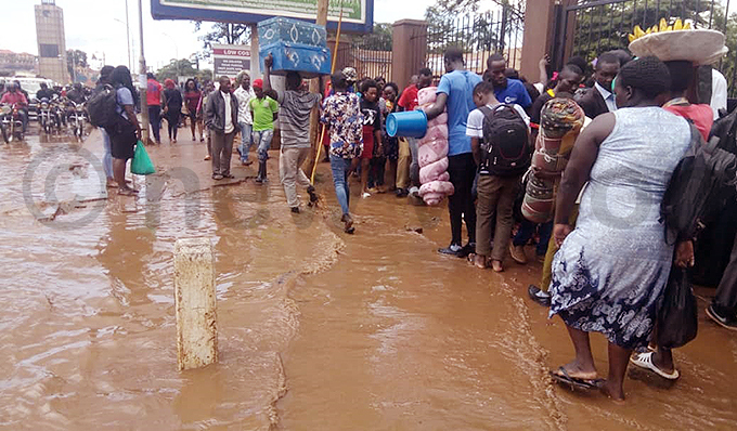edestrians try their best to avoid the flood waters near lock ower hoto by atrick ibirango