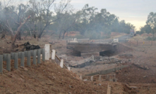 The scene of an explosion caused after a truck carrying fertiliser crashed and rolled on the Mitchell Hwy in 2014, injuring eight people.