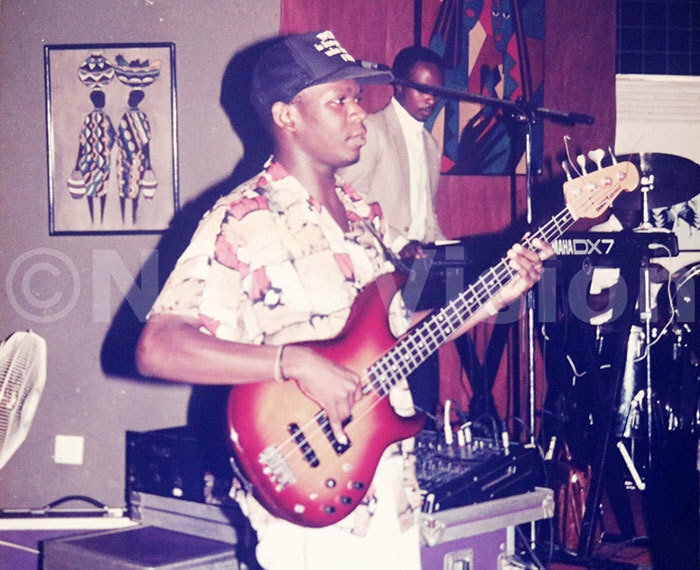 arry wanga playing the first  guitar he ever had 