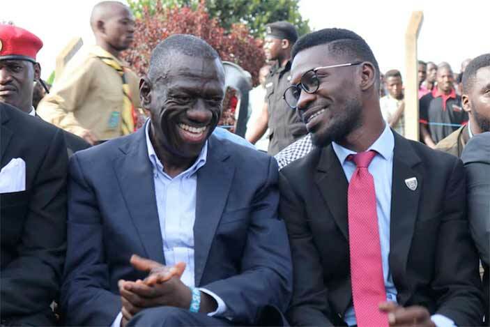  Besigye shares a light moment with Bobi Wine