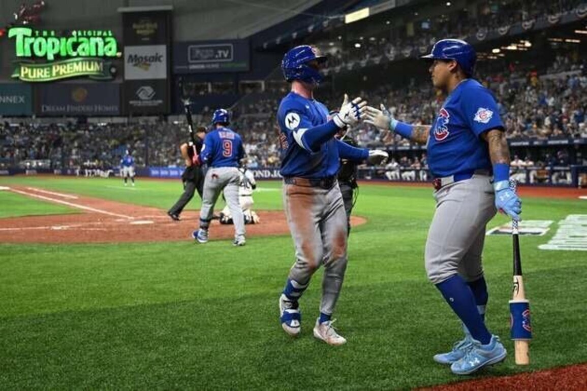 Bats aid Javier Assad's strong start as Cubs thump Rays
