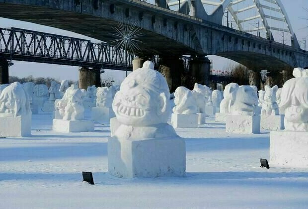 Snowmen adorn the Songhua River in Harbin