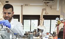 A Helios technician conducting molten regolith electrolysis.