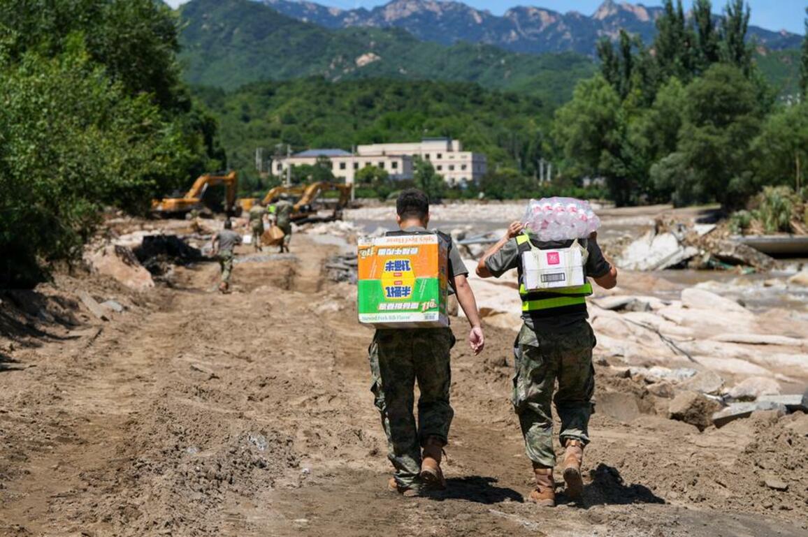 Beijing accelerates recovery efforts after rare downpours