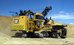 A Caterpillar 7495 electric rope shovel loading a Caterpillar 797F truck.