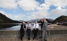  Scott Morrison sits on the wall of the Snowy Hydro project that he says will provide "Fari Dinkum" power