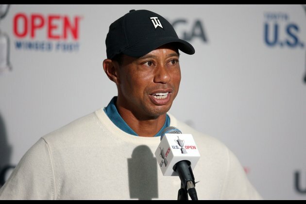 Golf Glance: Tiger Woods defends most recent title