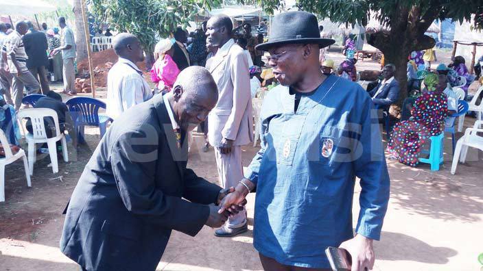  he leader of ango in the diastora ng r ichael dongo greeting zee kello kweta a member of the bereaved family in buje on ednesday hoto by onney dongo